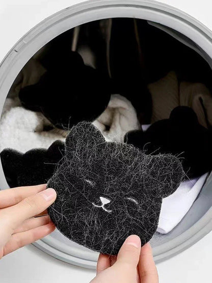 Pet Corner reusable pet hair remover in a washing machine, showing its durable fabric and effectiveness at removing pet hair from clothing.